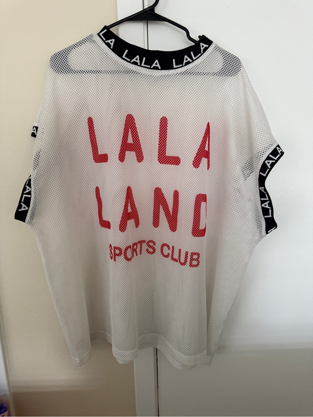 Dressed in Lala Sports Club Jersey
